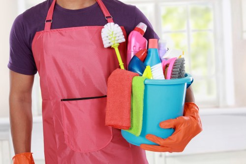 Office cleaners maintaining a Surrey workplace kitchen and meeting room