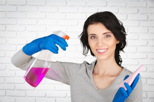 Cleaner working on a Surrey apartment as part of a one-off clean